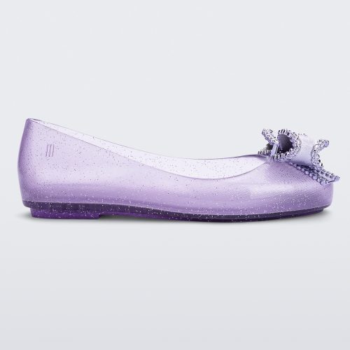 Side view of a lilac Mini Melissa Sweet Love kids flat with a metallic lilac bow.