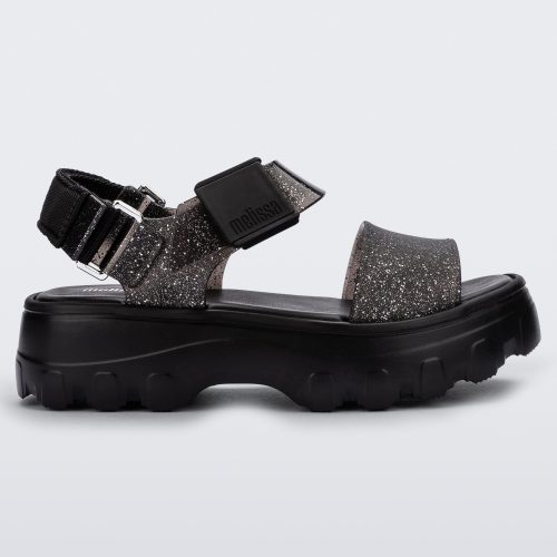 Side view of a black/glitter black platform Melissa Kick Off Sandal with two glitter straps.