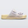 Side view of pearly yellow Cozy slide with two buckle straps.