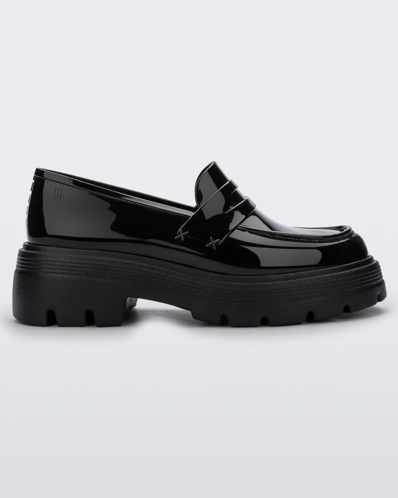 Side view of a Melissa Royal platform loafer in Black