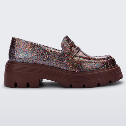 Side view of a Melissa Royal loafer in glitter multicolor with a brown platform sole.