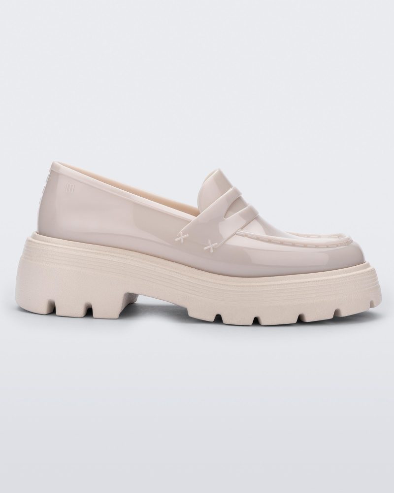 Side view of a Melissa Royal platform loafer in Beige