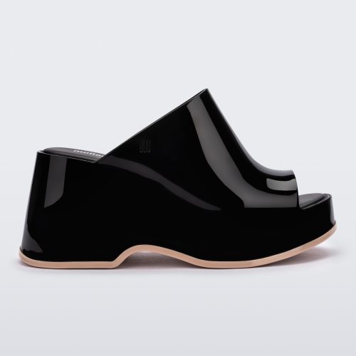 Side view of a Black Melissa Patty platform mule with beige outsole.