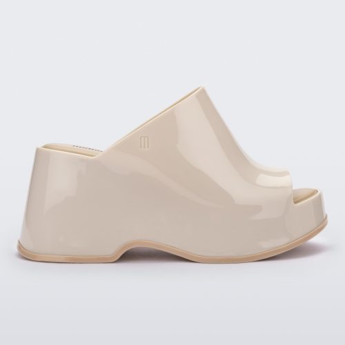 Side view of a Beige Melissa Patty platform mule.