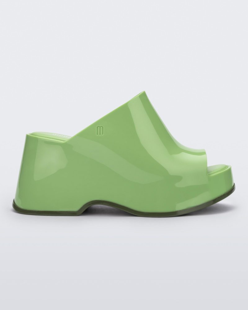 Side view of a green Melissa Patty platform mule.