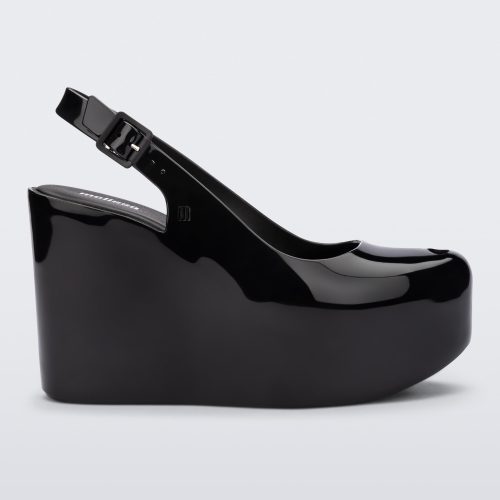 Side view of a black Melissa Groovy wedge platform slingback heel with peep toe.