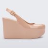 Side view of a beige Melissa Groovy wedge platform slingback heel with peep toe.