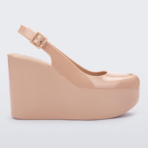 Side view of a beige Melissa Groovy wedge platform slingback heel with peep toe. 