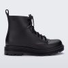 Side view of a black kids Melissa Coturno boot.