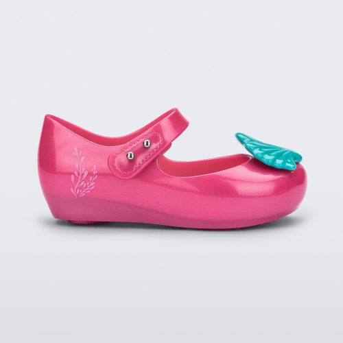 Side view of a pink Mini Melissa Ultragirl + Disney Little Mermaid flat with blue shell on top