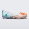 Side view of a transparent green and orange Mini Melissa Ultragirl + Disney Little Mermaid flat with a pearly orange flower on top