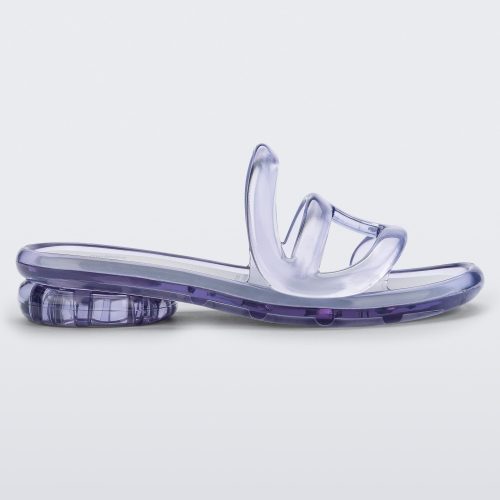 Side view of a Melissa Jelly Slides in Clear with white insole