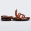 Side view of a Melissa Jelly Slides + Telfar in brown.