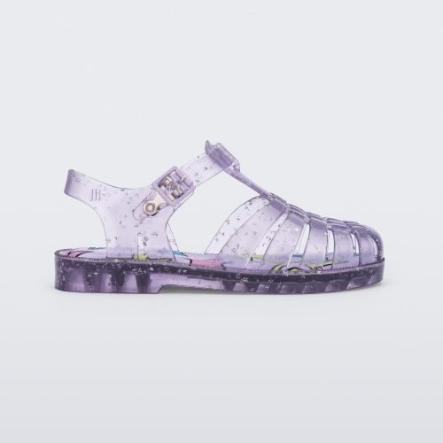 Side view of a clear lilac Possession kids sandal with star glitter