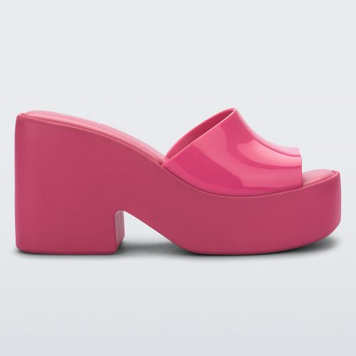 Side view of a Melissa Posh platform slide in pink