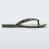 Side view of a green Melissa Harmonic Studs flip flop with gold studs on the upper.