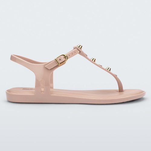 Side view of a pink Melissa Solar studs sandal with gold studded t-strap and gold buckle.