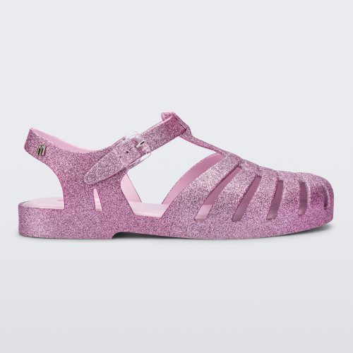 Side view of a pink glitter Possession sandal.