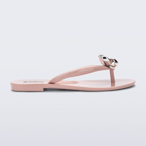 Side view of a pink Harmonic Eclipse flip flop with bow.