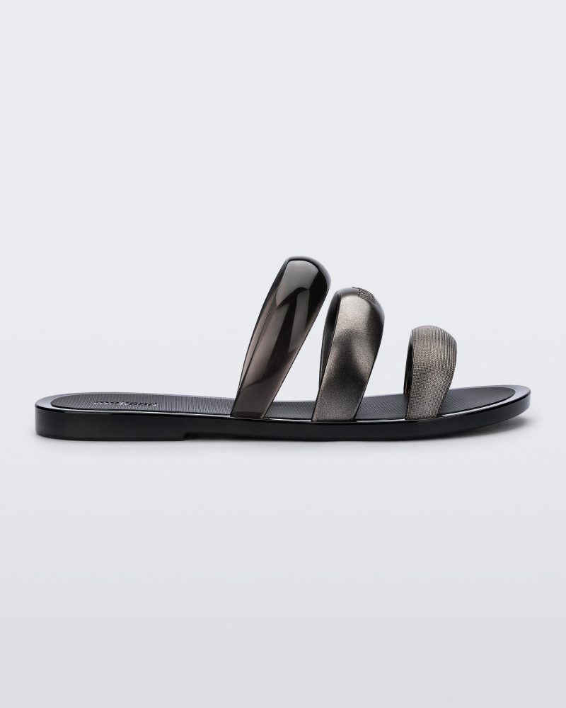 Side view of a black Eclipse Slide with silver and black straps.