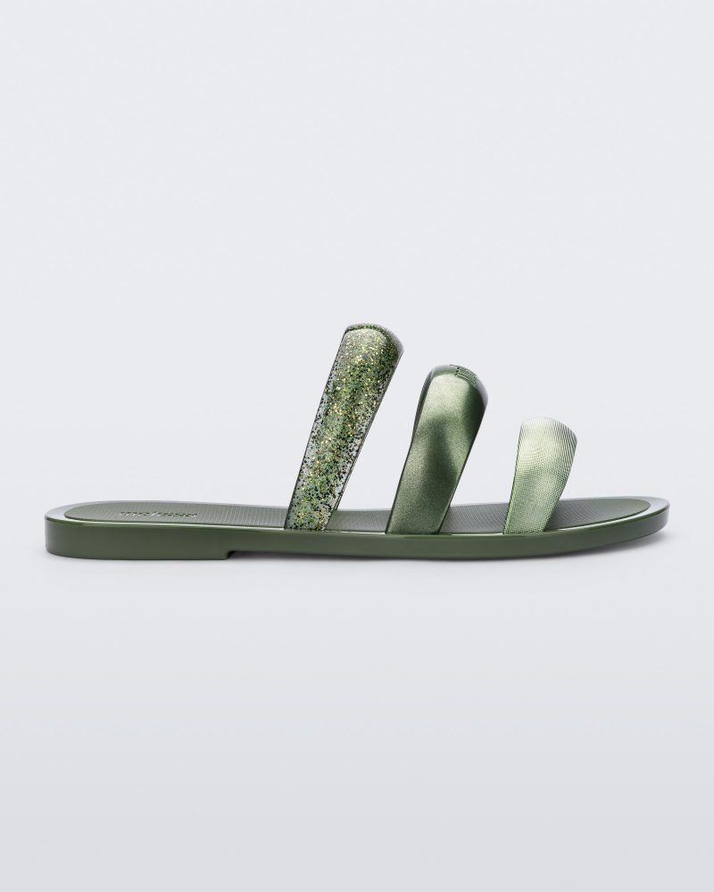 Side view of a green Eclipse Slide with glitter green straps.