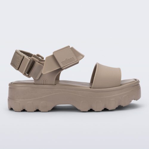 Side view of a beige Kick Off platform adult sandal.