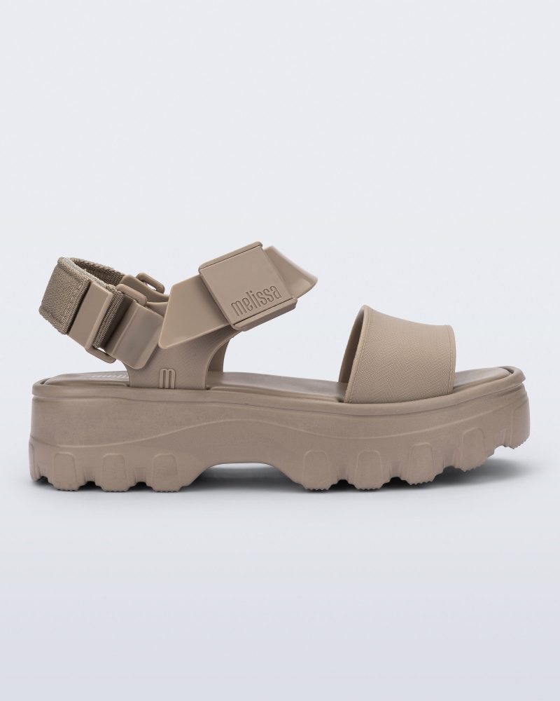 Side view of a beige Kick Off platform adult sandal.