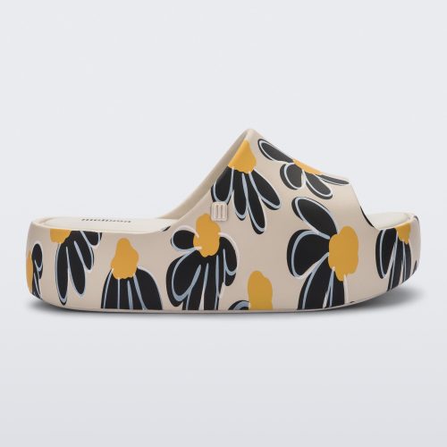 Side view of a beige Free Print Platform slide with a black and yellow flower print.