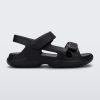 Side view of a black Free Papete sandal