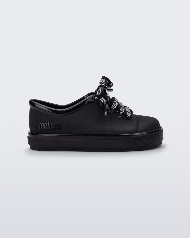 Side view of a black baby Hip M Lover sneaker with laces