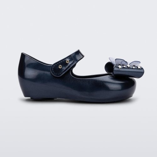 Side view of a Mini Melissa Ultragirl peeptoe ballet flat  for baby in blue with star printed butterfly bow applique.