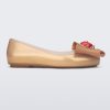 Side view of a beige Sweet Love Snow White kids flat with a beige bow with red apple center