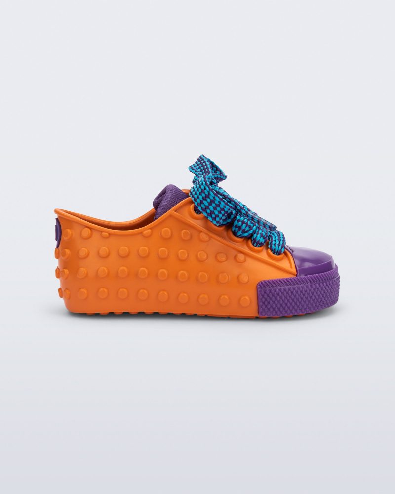 Side view of an orange and purple Polibolha baby sneaker with blue laces.