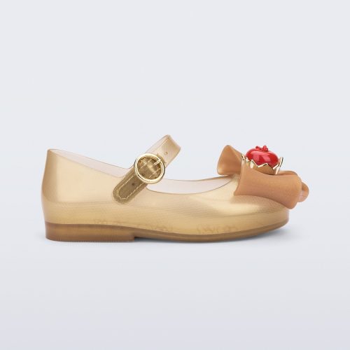 Side view of a beige Sweet Love Snow White baby flat with a beige bow with red apple center