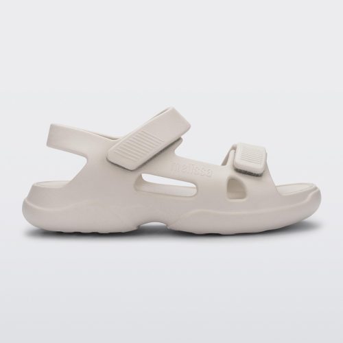 Side view of a beige Free Papete sandal