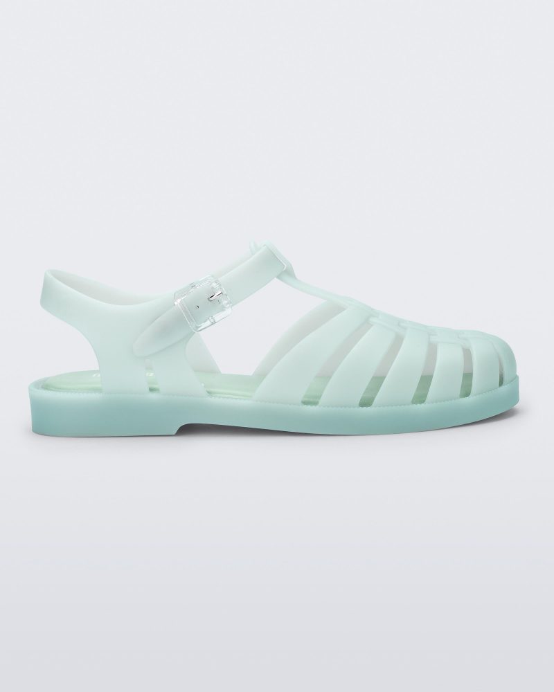 Side view of a light green Possession sandal