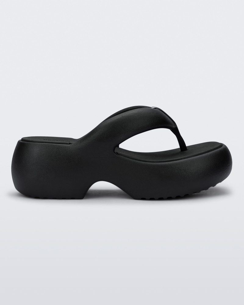 Side view of a black Free Platform II flip flop