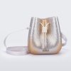 Front view of a silver/gold Lux bucket bag with drawstring and strap