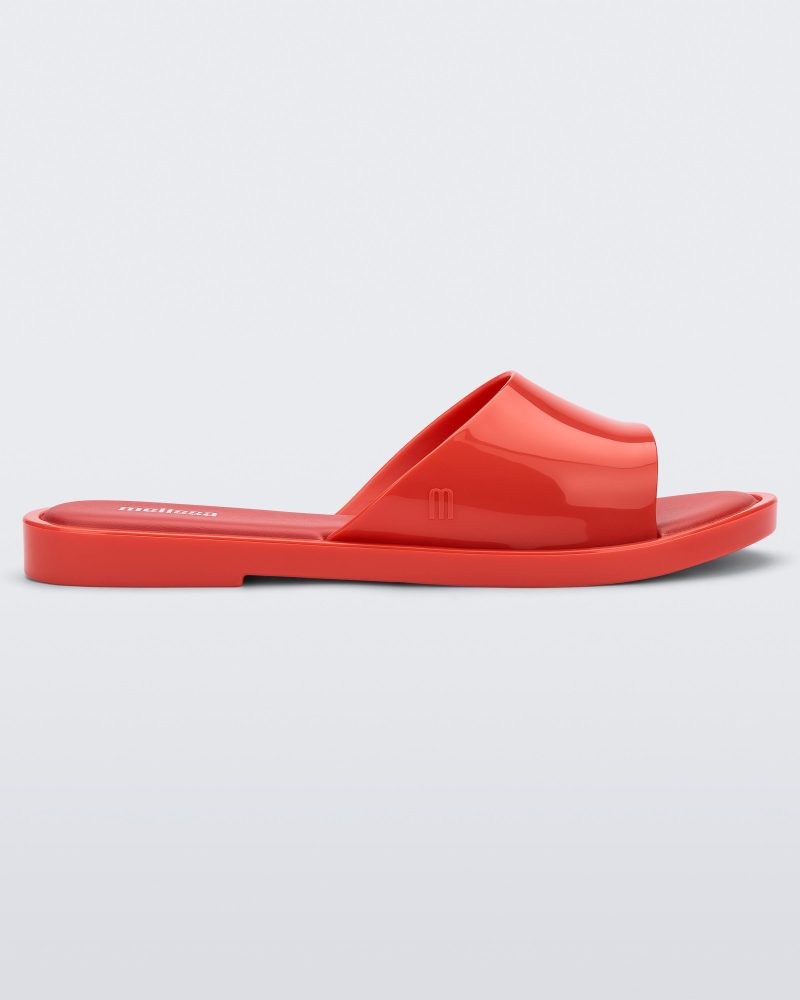 Side view of a red tortoiseshell Melissa Miranda slide