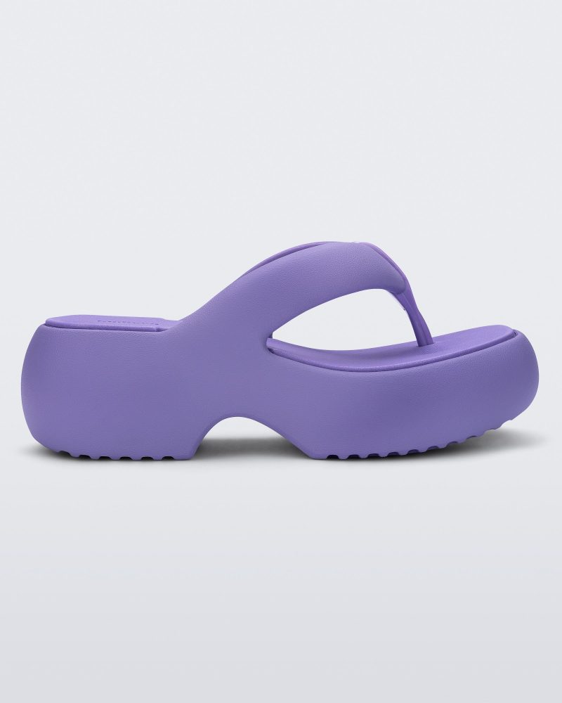 Side view of a lilac Free Platform II flip flop