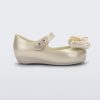 Side view of a Mini Melissa Ultragirl peeptoe ballet flat  for baby in white with star printed butterfly bow applique.