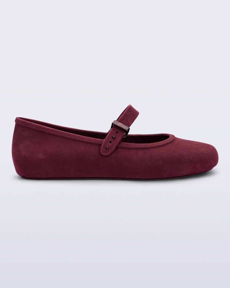 Side view of a burgundy red Soft Ballerina Velvet flat.