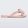 Side view of a Melissa slim strap flip flop in glitter pink with bow applique