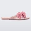 Side view of a pink Harmonic Springtime women's flip flop with 3 pink flowers.