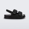 Side view of a matte black Mini Melissa Cozy sandal with two front straps with buckle detail