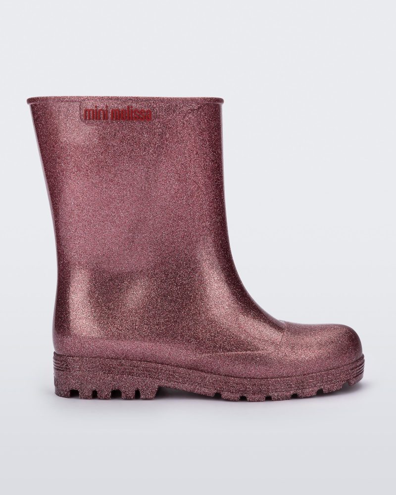 Side view of a glitter pink kids Welly rainboot