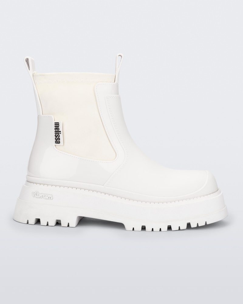 Side view of a white Drip Boot