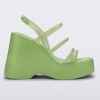 Side view of a green Jessie platform wedge sandal with side buckle ankle strap