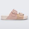 Side view of a Beige/Pink Melissa Cozy slide with two pink and beige straps with a buckle detail.