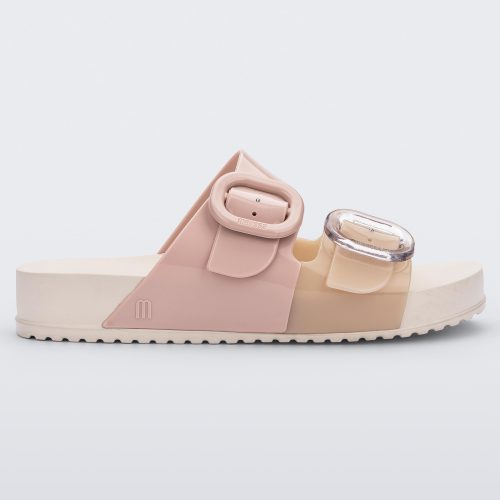 Side view of a Beige/Pink Melissa Cozy slide with two pink and beige straps with a buckle detail.